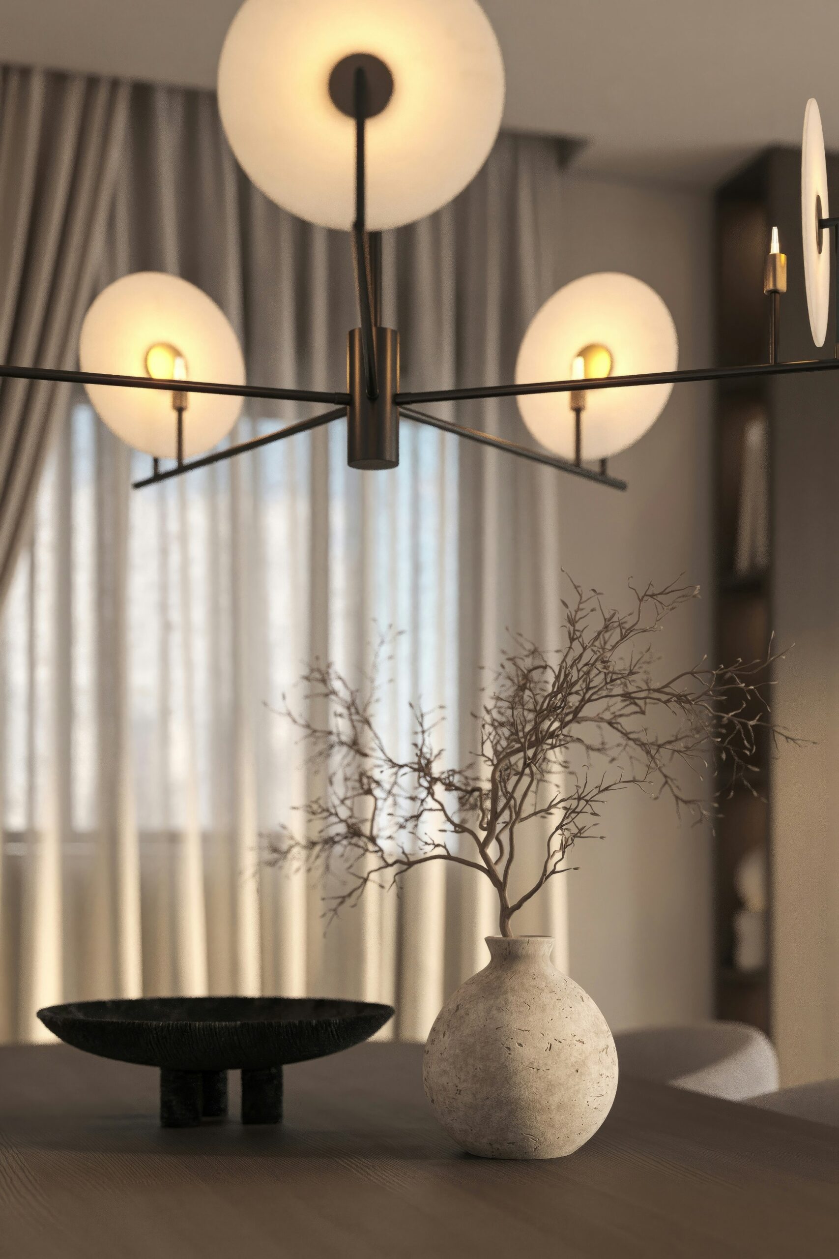 Softly lit minimalist bedside table with a warm ceramic lamp creating a cozy bedroom atmosphere.