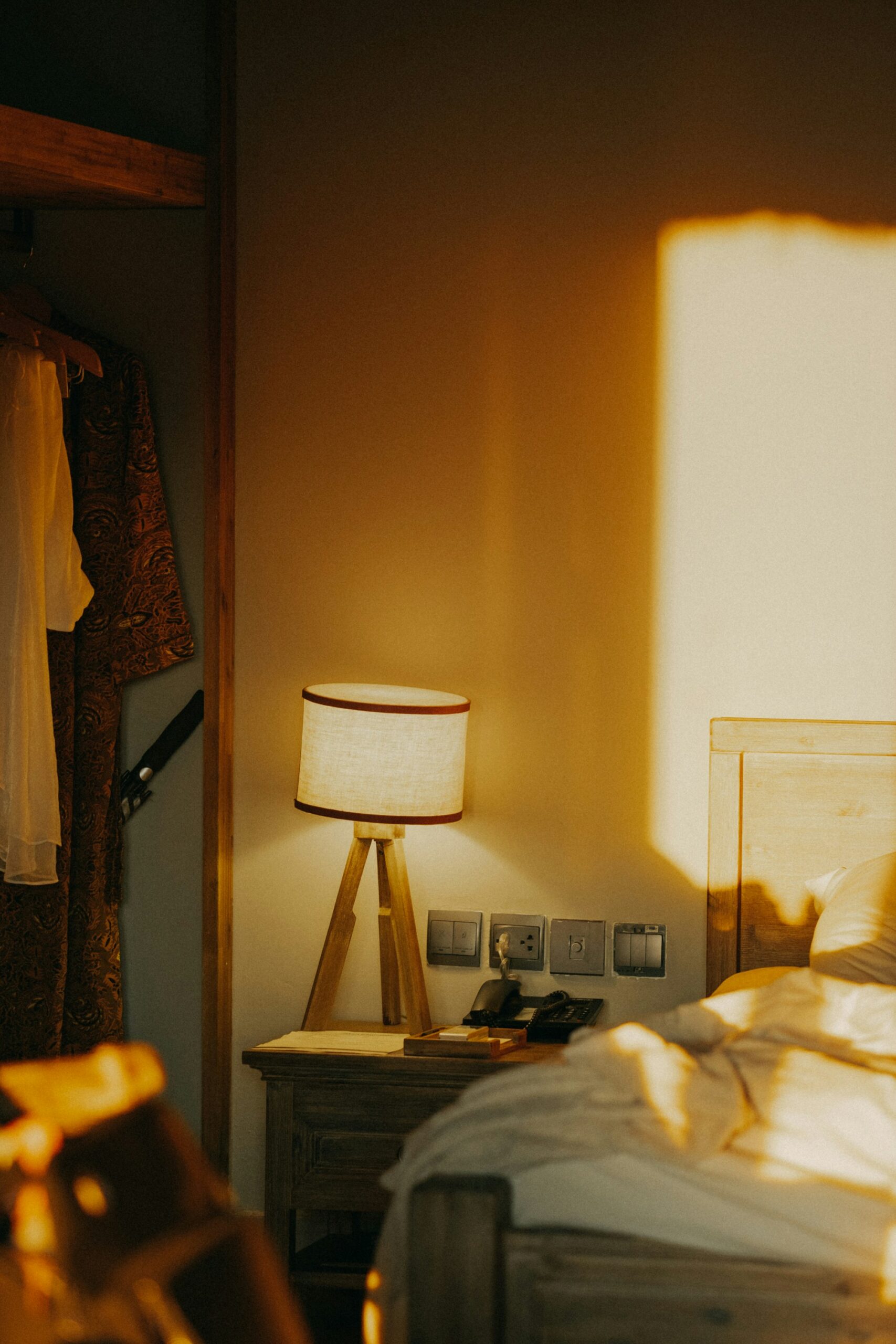 Minimal bedroom with hidden storage and a calm clutter-free atmosphere.