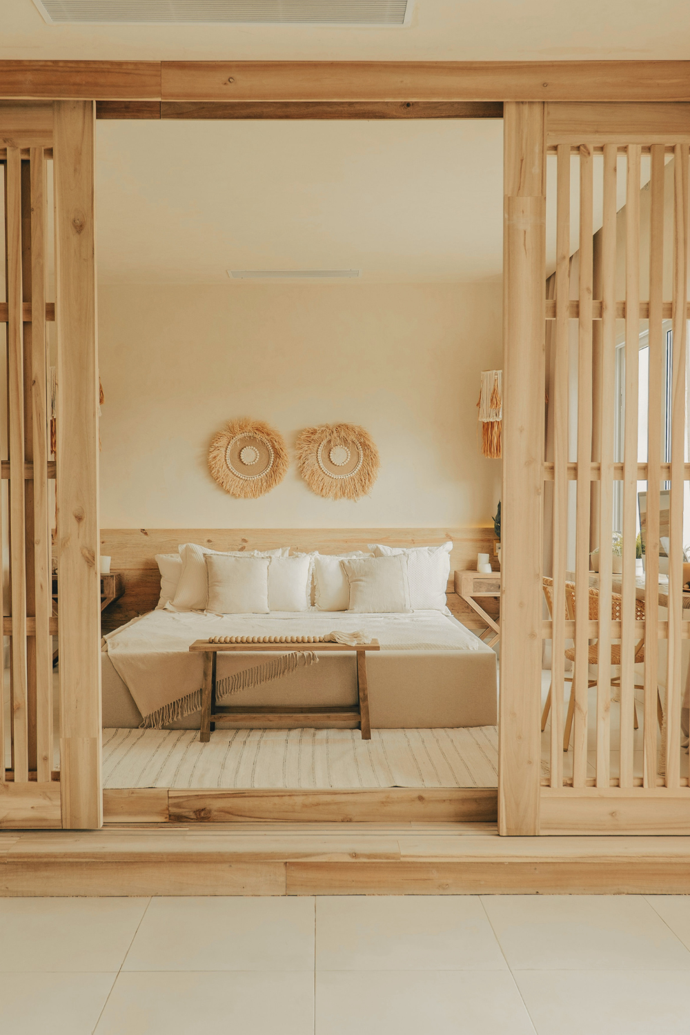 Neutral linen bedding in soft warm tones adding texture to a Japandi bedroom.