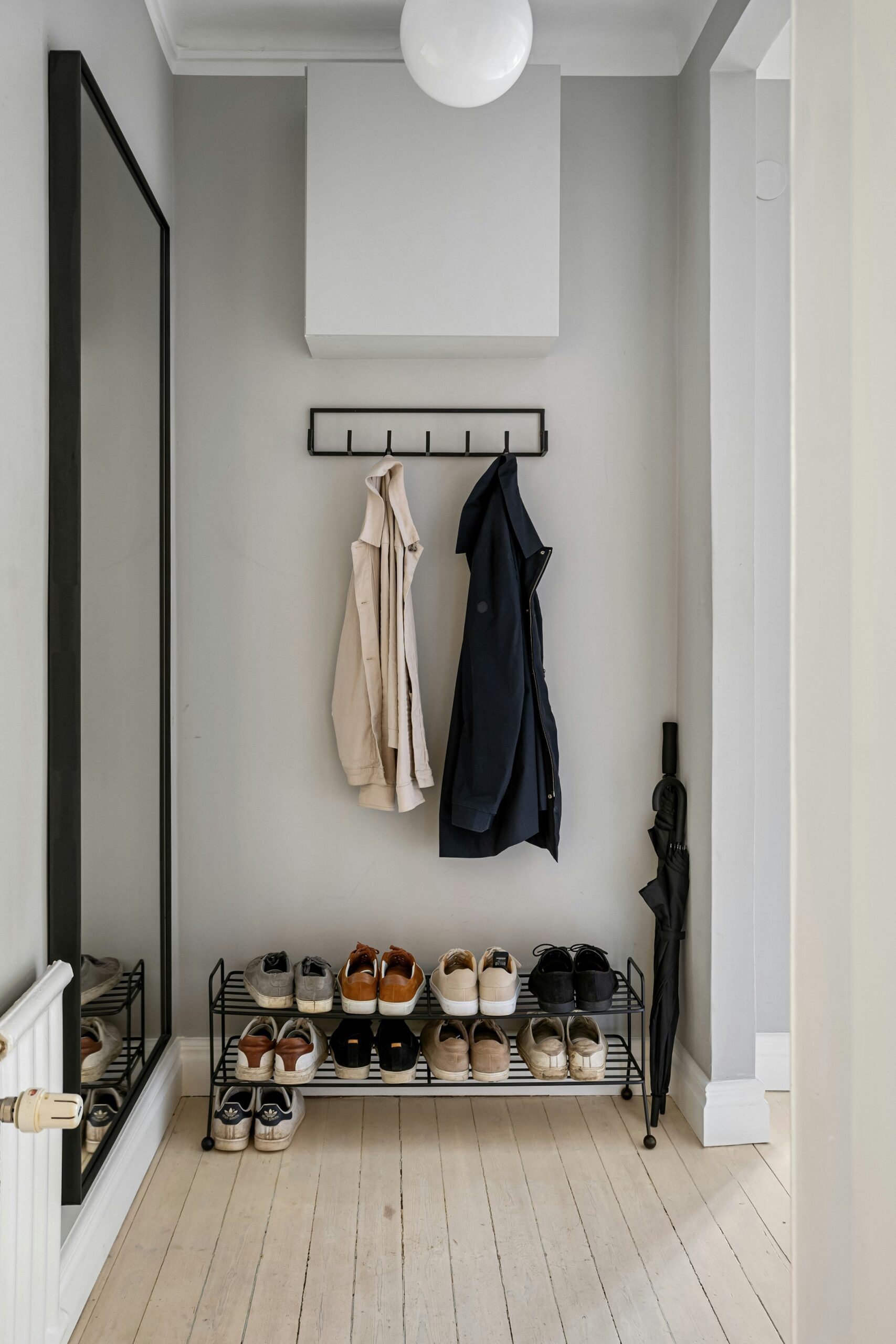 Bedroom with vertical storage ideas that free the floor and keep the room visually light.