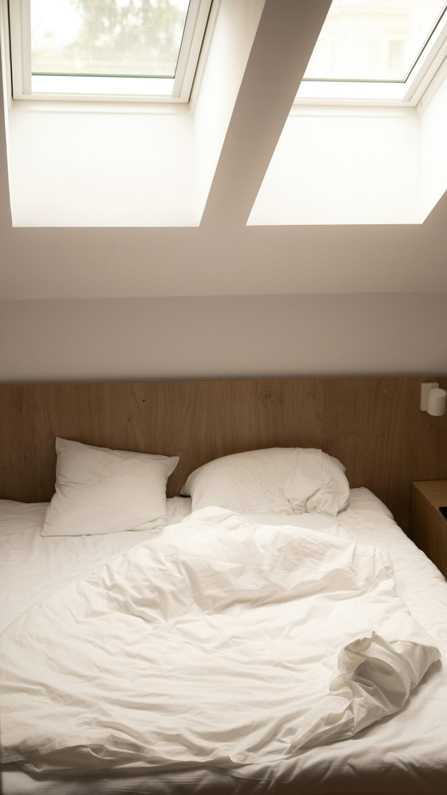 Bedroom arranged to welcome natural light and create an open relaxing atmosphere.